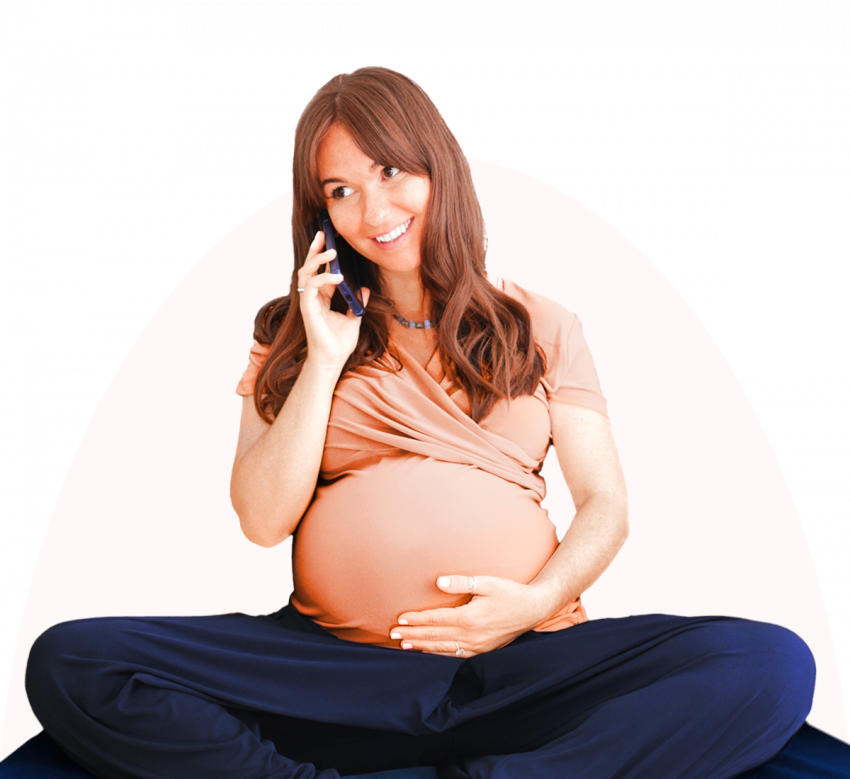 Expectant mother smiling while talking on the phone, exemplifying the supportive care and guidance provided by London Pregnancy Clinic
